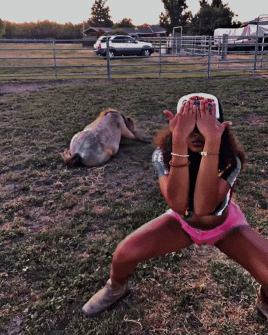 Curly Woman With Cap And Pink Shorts Get Low GIF
