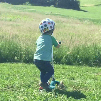Cute Baby Falling On Scooter Ride GIF