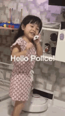 Cute Baby Girl Calling Police GIF