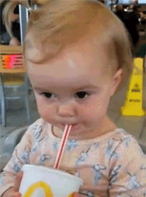 Cute Baby Girl Sipping Soda GIF