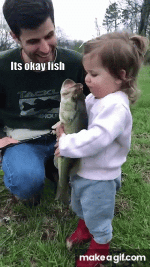Cute Baby Holding Fish GIF