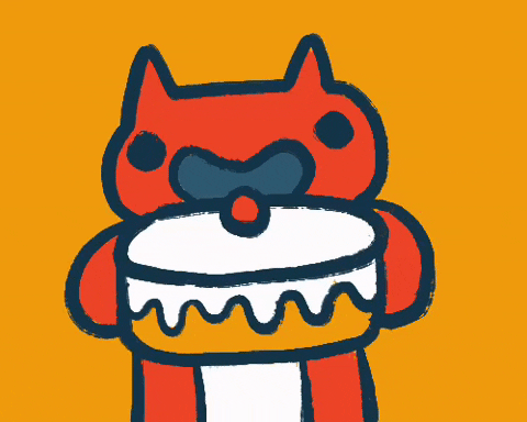 Cute Orange Cat Munching On Birthday Cake GIF