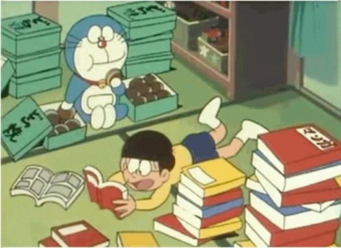 Cute Doraemon Eating Nobita Reading GIF