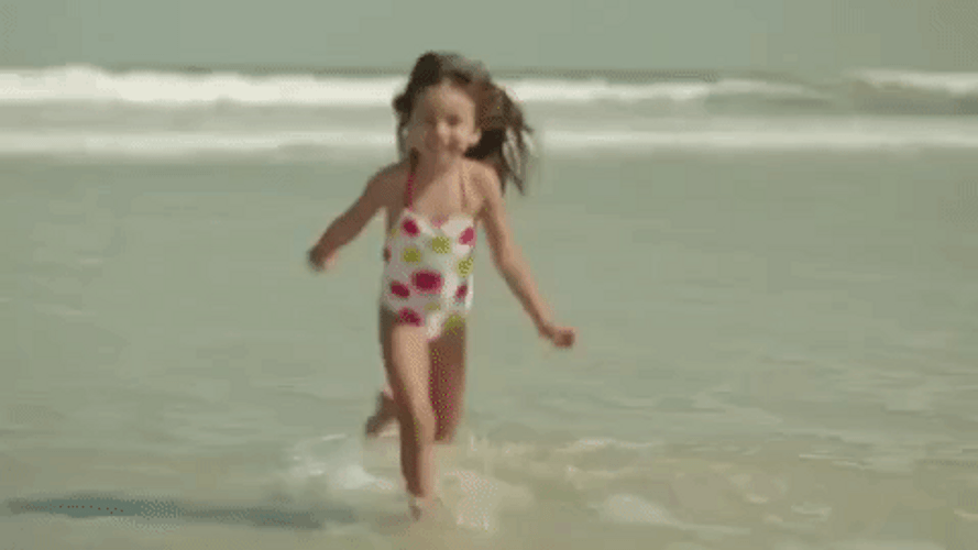 Cute Girl Running At The Beach GIF