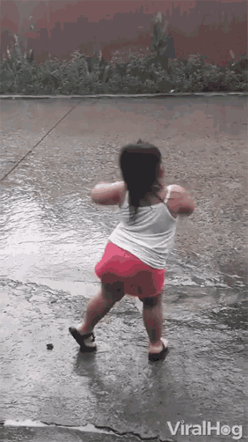 Cute Little Kid Dancing In The Rain GIF
