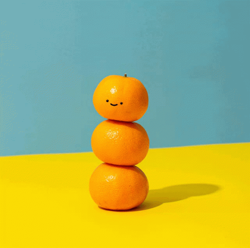 Cute Orange Smiling On Top Of Oranges GIF