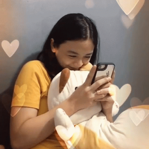Cute Woman Melted In Happiness In Front Cellphone GIF