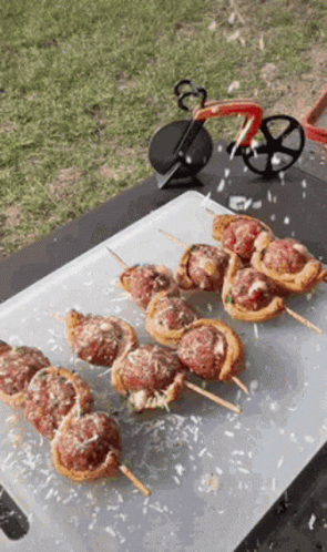 Cutting Board with Meatball Skewers and Pizza Cutter