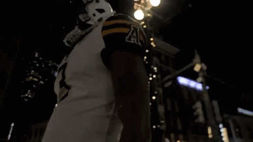 D. Evans Football Player in Helmet and Jersey