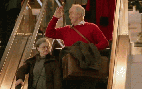 Daddys Home Don Whitaker Waving From Escalator GIF
