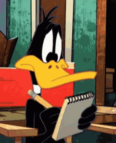 Daffy Duck Sitting At Table Holding Notebook And Pencil GIF