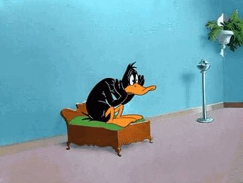 Daffy Duck Sitting on Couch with Fan