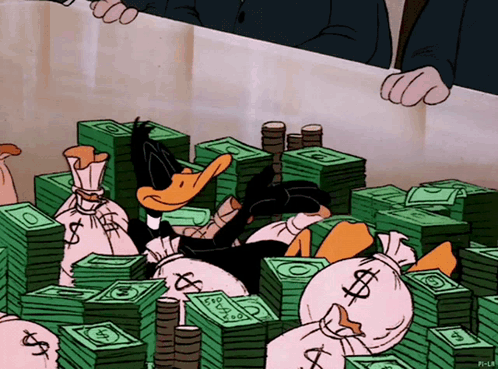Daffy Laying On Bed Of Money GIF