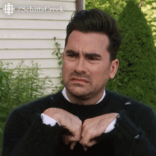 Dan Levy Awkward Grimace Face GIF