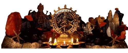 Dancing Deity Statue Surrounded by Candles and Crystals