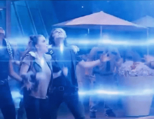 Dancing in Dark Room With Blue Lights