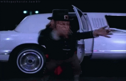 Dancing Leprechaun Grooving Elvis Presley Move GIF