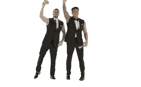 Dancing Men In Tuxedos With Dumbbells