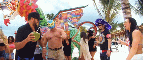 Dancing People On Beach With Luchador Mask GIF