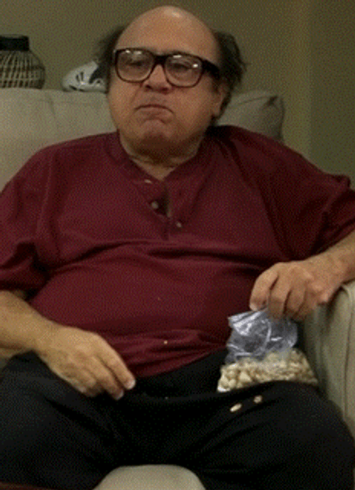Danny Devito Eating Nuts GIF