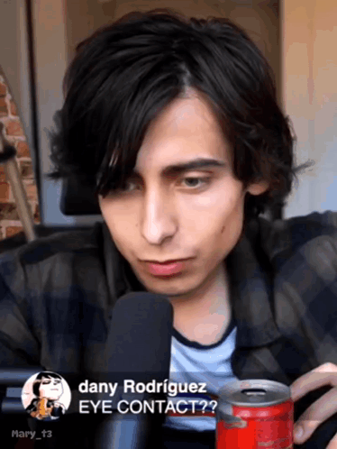 Dany Rodriguez Talking Into Microphone Holding Coke GIF