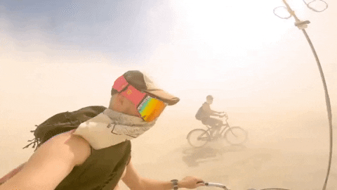 Daredevil Bike Ride Through Dust Storm GIF