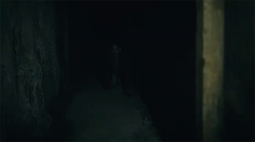 Dark Place With Crawling Man GIF