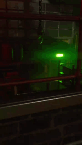 Dark Room With Green Light Through Window