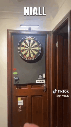 Dart Board on Door With Niall Above