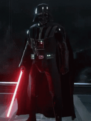 Darth Vader Is Holding A Red Lightsaber In A Dark Room GIF
