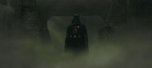 Darth Vader Is Holding A Red Lightsaber In The Fog . GIF