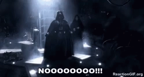 Darth Vader Is Standing In A Dark Room With A Sword In His Hand . GIF
