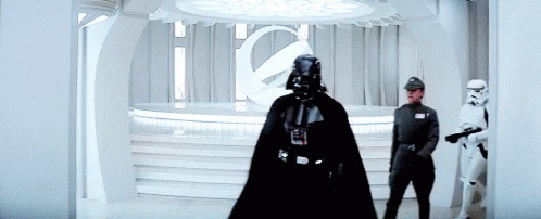 Darth Vader Is Standing In A Room With Stormtroopers . GIF