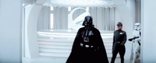 Darth Vader Is Standing In A Room With Two Storm Trooper Soldiers . GIF