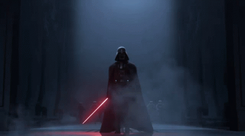 Darth Vader 'S Face Is Shown In A Dark Background GIF