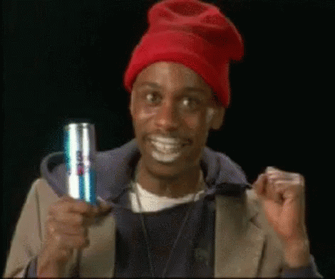 Dave Chappelle Holding Red Bull In One Hand GIF