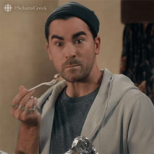 David Rose Nibbling Schitts Creek GIF