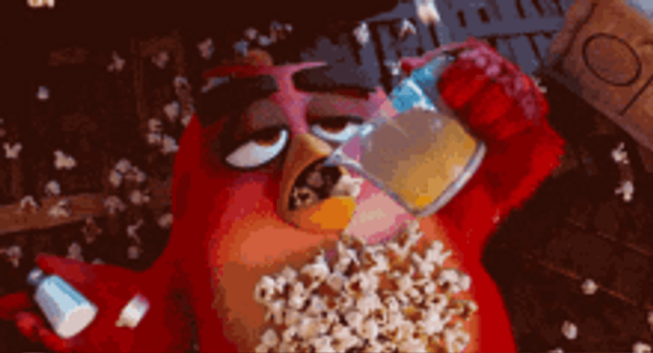 Dazed Angry Bird Consuming Too Much Popcorn Meme GIF