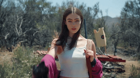 Dead Cat And Girl With Gun GIF