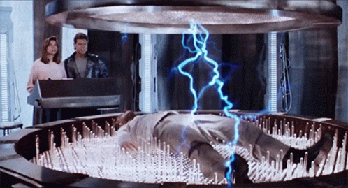 Dead Heat Scene Man Electrocuted GIF