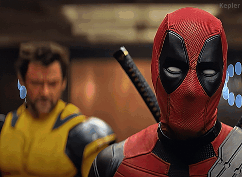 Deadpool Holding Sword In Front Of Yellow Suit Man GIF