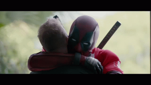 Deadpool Hugging Another Man