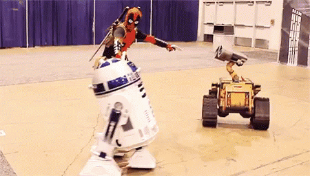 Deadpool Man Next to R2D2 and Wall E