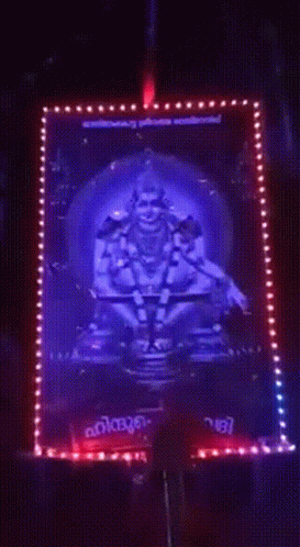 Deity Surrounded by Blue and Red Lights Kerala