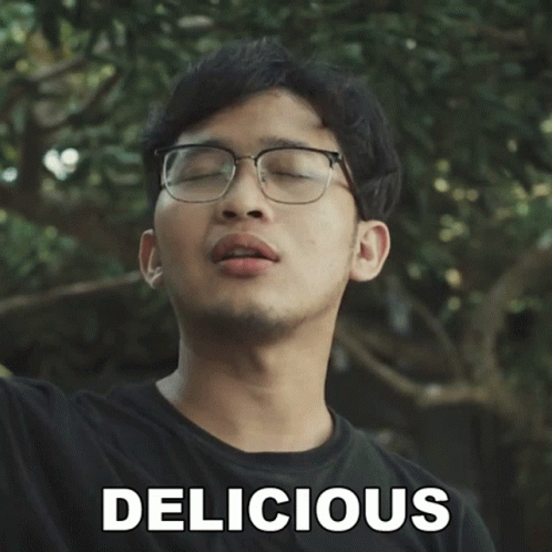 Man With Eyeglass Discussing Delicious Snack GIF