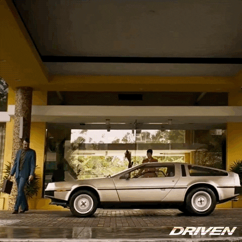 Delorean Parked In Front Of Building GIF