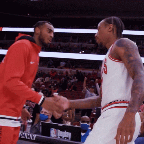 Demar Derozan And Troy Brown Shake Hands And Hug GIF