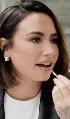 Demi Lovato Putting Lipstick GIF