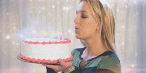 Demure Britney Spears Holding A Cake GIF
