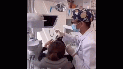Dentist Working On Patient's Teeth GIF